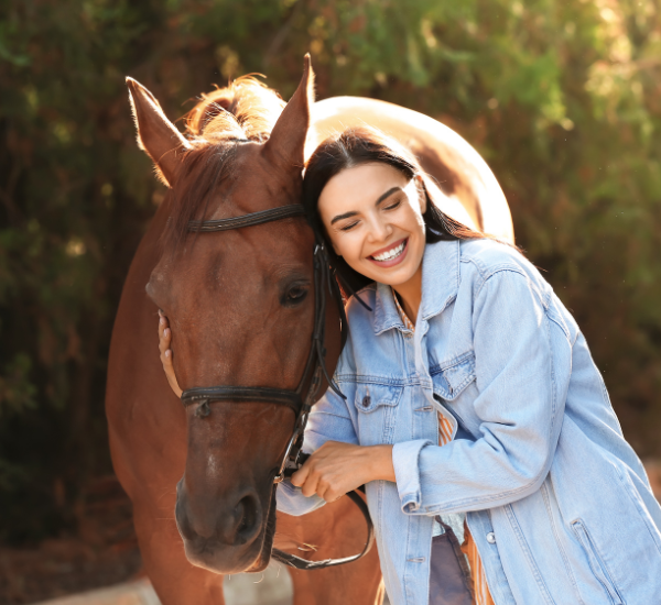 woman embracing a horse